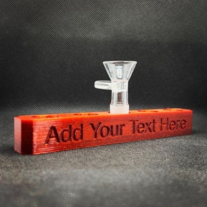May include: A red wooden stand with the text "Add Your Text Here" engraved on it. A clear glass bowl sits on top of the stand.