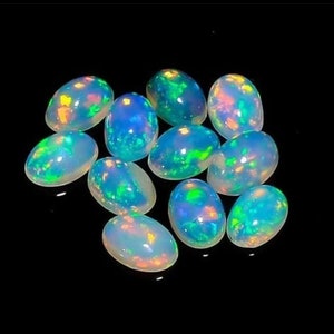 Ovale AAA ++ Opale di fuoco etiope naturale di alta qualità Forma ovale Lotto all'ingrosso Incredibile cabochon opale di qualità ~ Pietra preziosa opale etiope naturale.