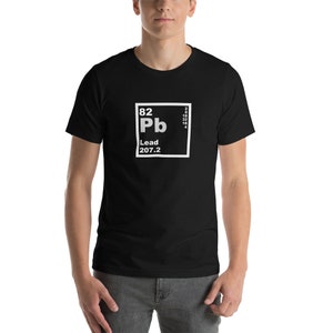 May include: Black t-shirt with a white graphic of the periodic table element Lead (Pb) with the atomic number 82 and atomic weight 207.2.