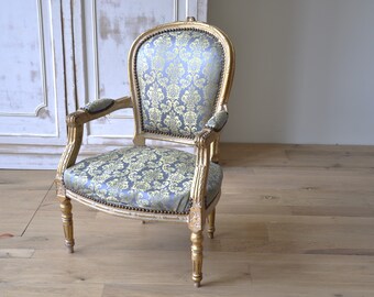 Louis XVI Classic Baroque chair with light blue upholstery and golden wood, vintage accent chair