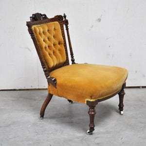 Antique 1800s ladies chair with wheels in yellow velvet