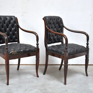 Antique chairs from the 1800s in black leather