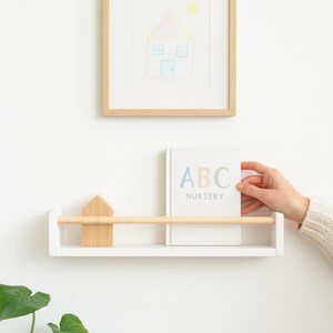 Scandinavian style white nursery bookshelf with oak rail, handcrafted wooden wall shelf for nursery wall decor
