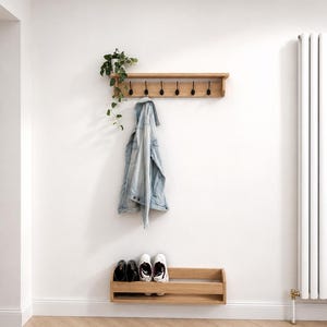 Floating oak entryway shoe rack creating extra floor space while storing shoes neatly.