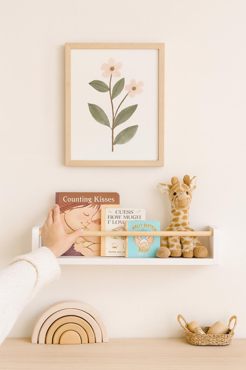 Floating white nursery shelf with oak pegs, stylish baby room organizer for clothes, toys and books