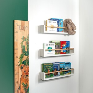 White wooden nursery shelf with rod, handmade floating wall shelf for kids’ bedroom storage