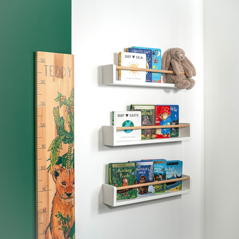 White wooden nursery shelf with rod, handmade floating wall shelf for kids’ bedroom storage