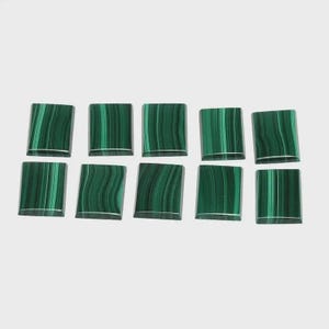 May include: Ten square-shaped malachite gemstones with a polished finish. The stones display a vibrant green color with darker green, wavy patterns. Each stone has a silver-colored edge, and they are arranged against a white background.