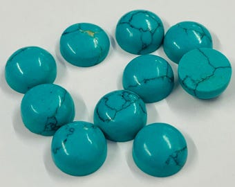 May include: Ten turquoise cabochons are displayed, each with a rounded dome and flat base. The stones are a vibrant blue-green with dark veining. These polished gemstones are suitable for jewellery making and crafting projects.