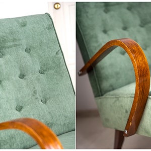 May include: A green velvet armchair with wooden arms. The chair has a tufted back and a buttoned design.