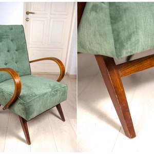 May include: A green velvet armchair with wooden arms and legs. The chair has a tufted back and a simple design.