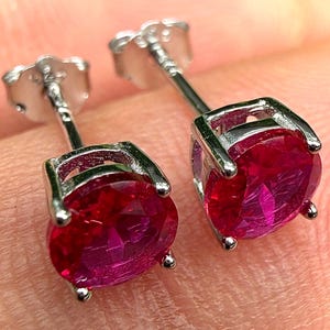 May include: A set of three ceramic nesting bowls in shades of blue, green, and white. The bowls feature a speckled glaze and a simple, modern design. The largest bowl measures approximately 6 inches in diameter.