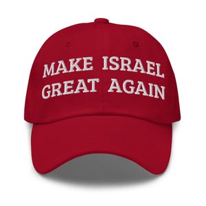 May include: A red baseball cap with the embroidered text "MAKE ISRAEL GREAT AGAIN" in white. The cap has a curved brim and a button on top. The hat is a classic style, suitable for casual wear.