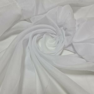 May include: White sheer fabric, soft and flowing, with a delicate texture. The fabric is draped in a swirl pattern, highlighting its lightweight and airy quality.