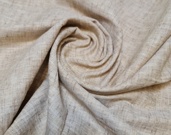 May include: A close-up of a beige linen fabric with a textured surface. The fabric is folded and draped in a spiral pattern.