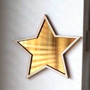 Arte da parete con specchio a stella, specchio dorato, cornice in legno