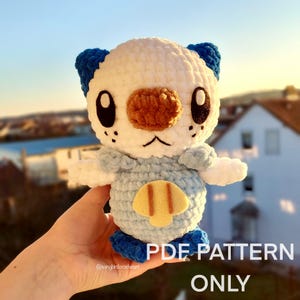 Peut inclure: Patron d'amigurumi au crochet pour un personnage Pokemon blanc et bleu avec un nez brun et des accents jaunes. Le patron est disponible en téléchargement PDF.  PDF PATTERN ONLY.