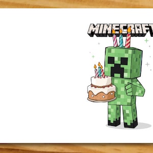 May include: A green Minecraft character holding a birthday cake with candles. The cake is white with brown icing and sprinkles. The character is wearing a green and black outfit and has a green face with a black smile. The text "MINECRAFT" is above the character.