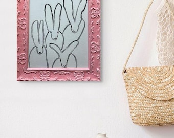 "The Quadrumvirate" in a Pink Frame