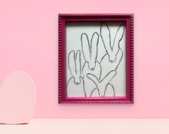 "The Quadrumvirate" in a magenta frame