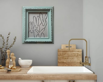 "The Quadrumvirate" in seafoam green frame