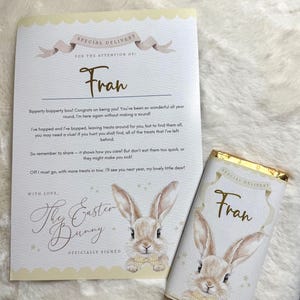 May include: A cream-coloured Easter card and chocolate bar set. The card reads "Special Delivery" and "Fran" in elegant script. The chocolate bar wrapper mirrors the card design, both featuring a bunny illustration.