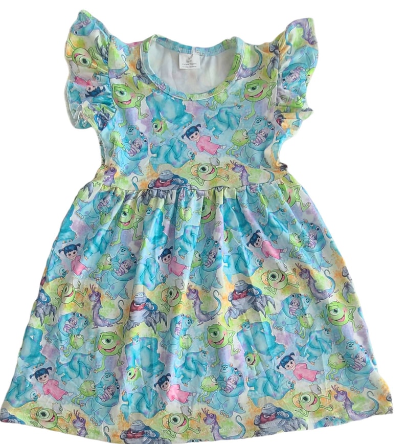 May include: A blue and green sleeveless dress with a ruffled neckline and a print of characters from the movie Monsters Inc.
