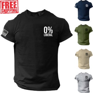 May include: Black short-sleeved t-shirt with the text "0% LIBERAL" in white on the front. An American flag is on the left sleeve. Additional shirts in navy blue, olive green, tan, and gray are also shown.