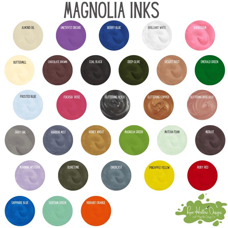 May include: A color chart titled Magnolia Inks displaying twenty-eight circular swatches of various ink colors, each labeled with names like Almond Oil, Amethyst Orchid, Berry Blue, Coal Black, and Ruby Red, arranged in a grid on a white background.