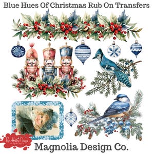 May include: A sheet of Blue Hues Of Christmas Rub On Transfers by Magnolia Design Co. featuring watercolor illustrations of three nutcrackers, two blue birds on pine branches, various blue and white Christmas ornaments, and holly berries.