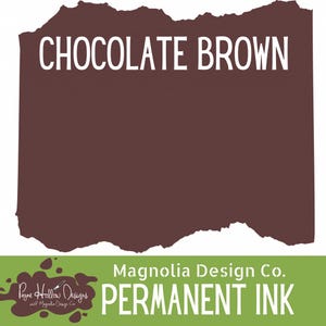 May include: A rectangular swatch of chocolate brown permanent ink with a torn paper edge effect. The text CHOCOLATE BROWN is printed in white at the top. A green banner at the bottom displays the text Magnolia Design Co. PERMANENT INK.