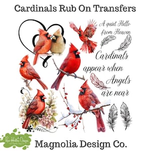 May include: A set of Cardinals Rub On Transfers featuring red cardinal birds, a black heart outline, and the text A quiet Hello from Heaven and Cardinals appear when Angels are near. Includes illustrations of feathers and Magnolia Design Co. text.