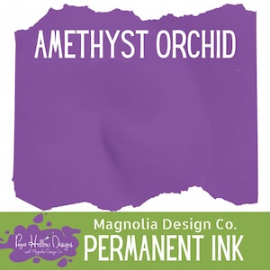 May include: A rectangular swatch of solid purple ink labeled AMETHYST ORCHID in white text. Below, a green banner displays the white text Magnolia Design Co. PERMANENT INK and a purple logo with the text Payne Hollow Designs with Magnolia Design Co.
