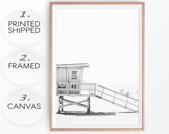 May include: Black and white photograph of a lifeguard stand on a beach. The stand has a sign that reads "Lifeguard on Duty Keep Off". The number "40" is visible on the stand.