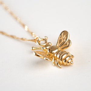 Bee necklace.