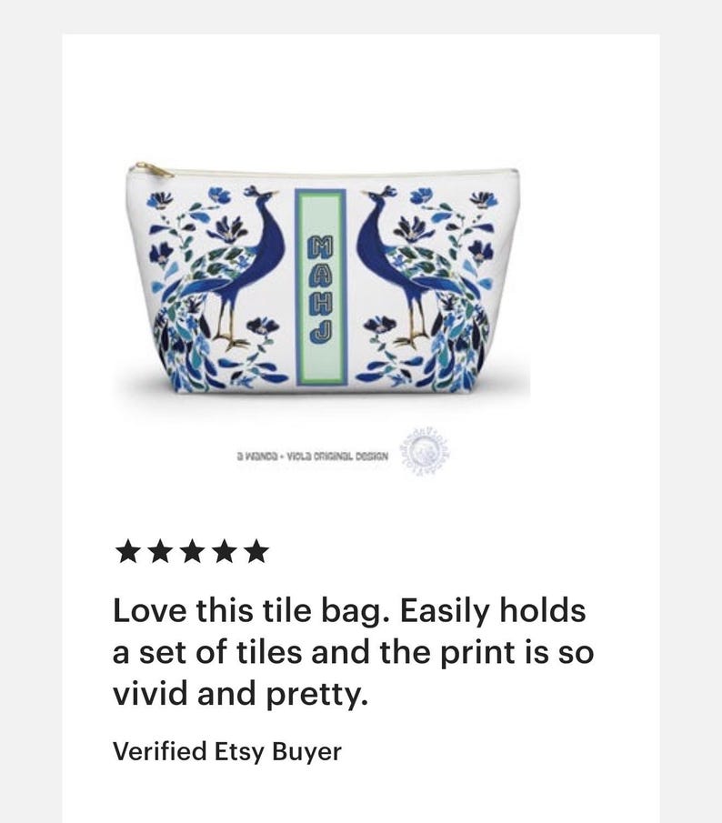 May include: White zippered pouch with a peacock design in shades of blue and green. The bag features two peacocks facing each other, with floral accents and the letters "MAHJ" in a vertical rectangle. The text "a wanda - viola original design" is at the bottom.