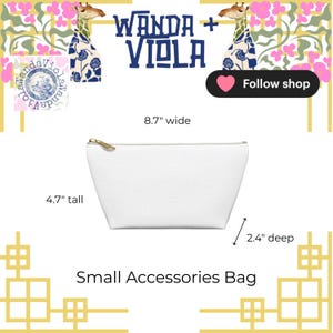 May include: White small accessories bag with a gold zipper, measuring 8.7 inches wide, 4.7 inches tall, and 2.4 inches deep. The bag has the text "Wanda + Viola" and "Small Accessories Bag".
