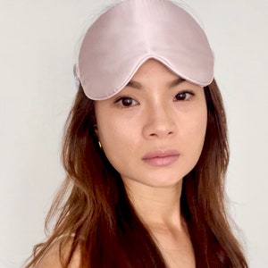 Large pure silk eye mask with real silk floss inside and 100% mulberry silk outside give you uninterrupted beauty sleep by block light