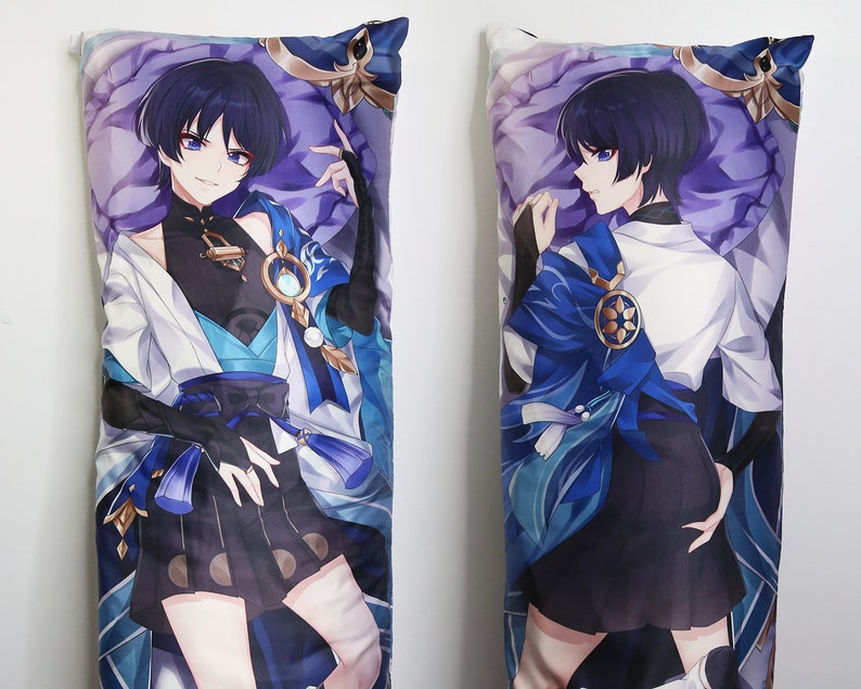 May include: A long body pillow featuring an anime character with blue hair, wearing a white shirt with a blue and gold sash, and a black skirt. The character is standing with one hand on their hip and the other hand raised.