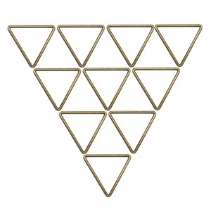 May include: Ten brass-coloured, triangular rings arranged in a triangular formation against a white background. The rings are uniform in size and shape, with a simple, geometric design.