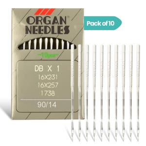 May include: A pack of 10 Organ Needles for sewing machines, model DB X 1, 16X231, 16X257, 1738, size 90/14. The packaging is tan with black text and a teal accent. Ten individual silver metal needles are displayed alongside the rectangular box.