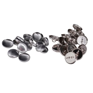 May include: Two sets of silver metal buttons. One set is flat and the other set has a shank.