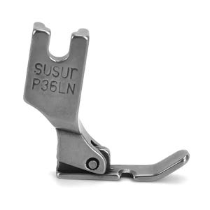 May include: A silver-colored metal sewing machine presser foot with a hinged design. The vertical shank features the embossed text SUSUT P36LN. The component has a flat base with a curved front edge and a U-shaped opening at the top for attachment.