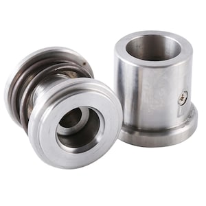 May include: Two cylindrical silver-colored metal components. One piece features a coiled metal spring wrapped around its body. The other piece is a smooth, hollow cylinder with a small screw visible on its side. Both items have a metallic finish.