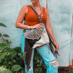 Leather and cowhide tassel crossbody bag