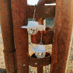 White disco cowgirl earrings