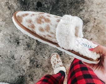 Brown and white cowhide house slippers