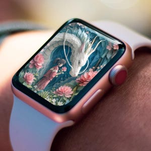 May include: A rose gold smartwatch with a white strap shows a digital illustration. The artwork depicts a white dragon, a girl in a red dress, and pink flowers. The background is a mix of blue and green.