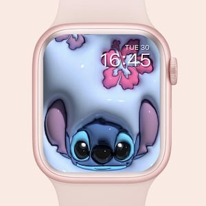 May include: A rose gold smartwatch with a Stitch-themed display. The screen shows a blue cartoon character with large ears and eyes, surrounded by pink hibiscus flowers. The time is displayed as 16:45 on Tuesday.