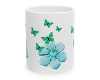 Taza de café de cerámica con flores y mariposas verde azulado
